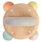 A top view of the PlanToys Pastel Bell Rattle on a plain background.