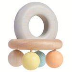 A side view of the PlanToys Pastel Bell Rattle on a plain background.