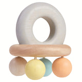 A side view of the PlanToys Pastel Bell Rattle on a plain background.