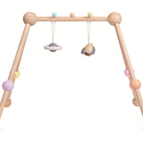 The PlanToys Pastel Play Gym on a plain background.
