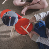 an eco-friendly and plastic-free wooden drum kit for toddler's on a white background.