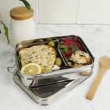 A slice of green large lunchbox with mini container available at Babipur standing on a kitchen worktop