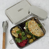 A top down image of the A slice of green large lunchbox with mini container with various food items inside