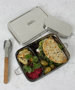 A top down image of the A slice of green large lunchbox with mini container with various food items inside
