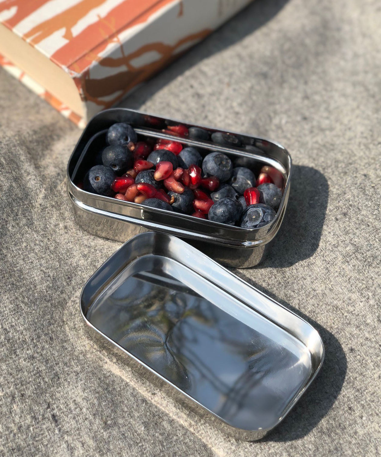 A close up of the mini container from the A slice of green large lunchbox showing different fruit items inside