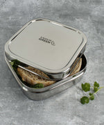A close up of the A slice of green shimla large square container lunchbox showing the stainless steel finish detail