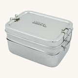 A slice of green two tier lunch box with mini container available at Babipur. A stainless steel two tier rectangular lunchbox with clips on each side for a secure lock