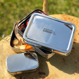 A close up of the A slice of green two tier lunchbox with mini container showing the stainless steel finish detail