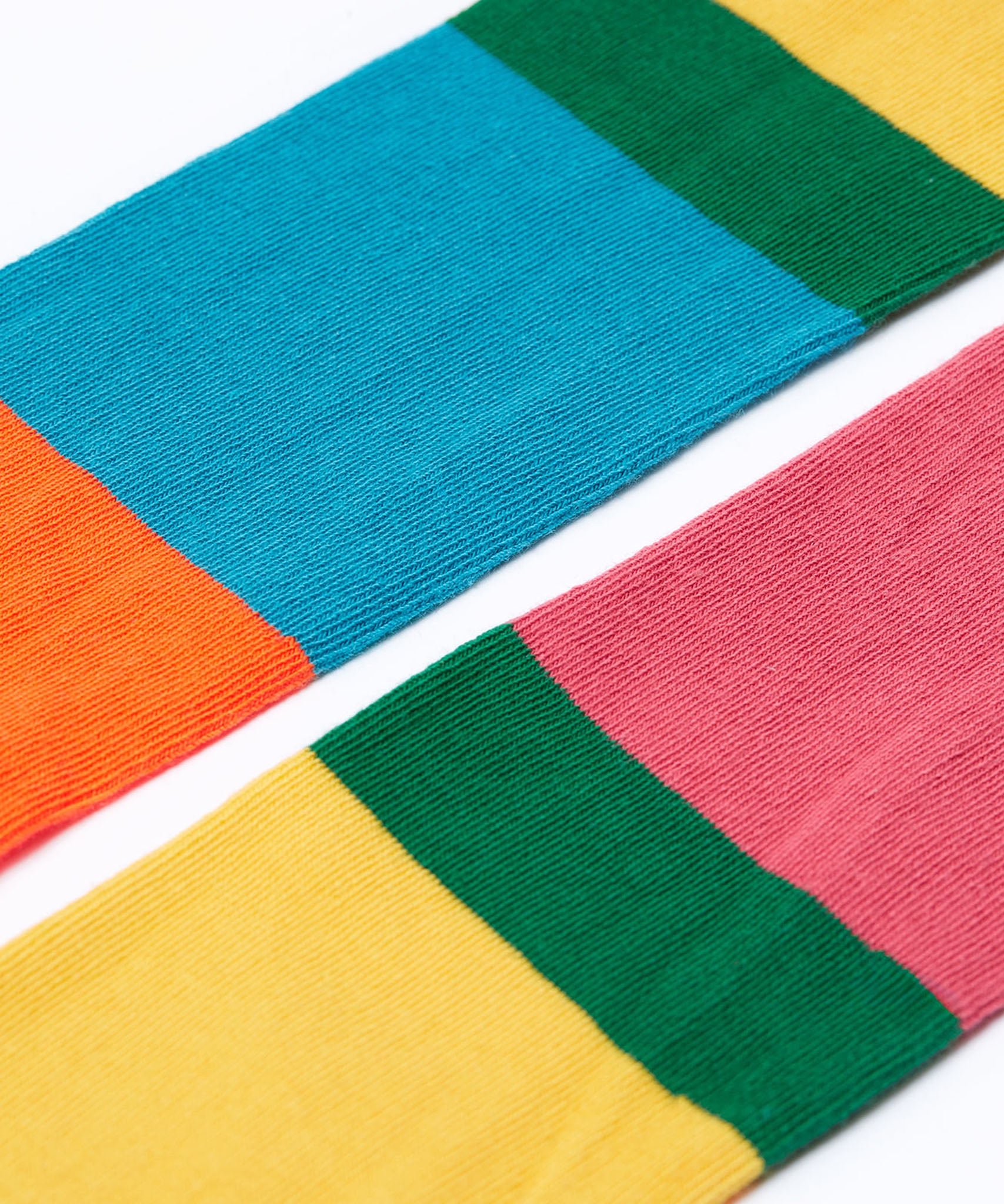A close up of the colour block, hotchpotch design Frugi Norah children's tights.