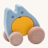 Bajo children's plastic-free wooden push along ghost toy in the blue and yellow colour on a cream background