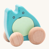 Bajo children's plastic-free wooden push along ghost toy in the turquoise colour on a cream background