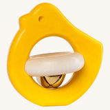 Bajo yellow bird rattle available at Babipur.  A wooden bird rattle with a bell in the middle.