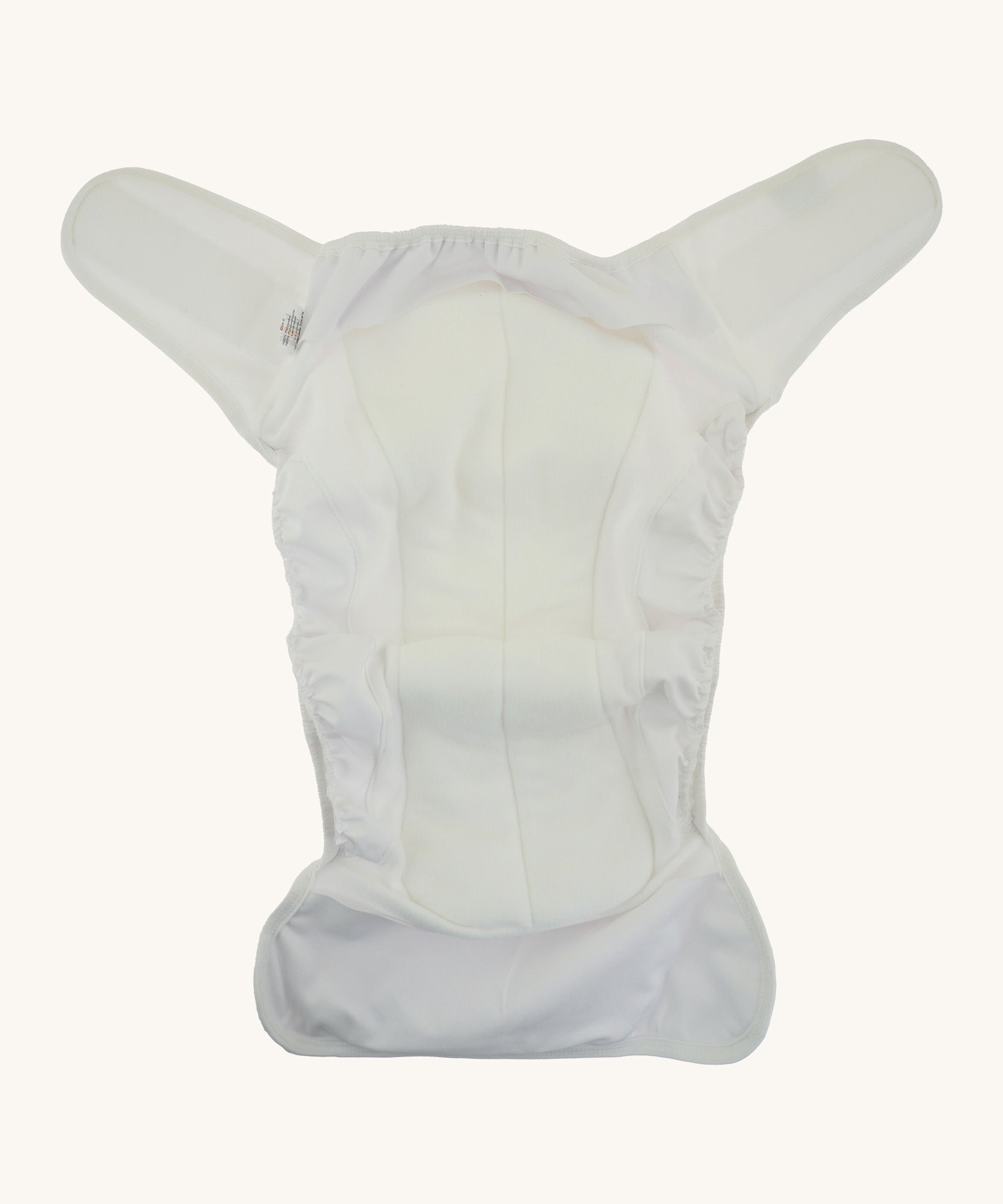 A open Bambinex adult incontinence nappy available at Babipur in white. Features a velcro fastener and a built in booster for absorbency. Pockets on each end of the nappy allows room for a booster for extra absorbency.