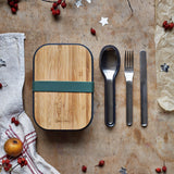 Black + Blum stainless steel cutlery set with portable hygienic carry case resting next to a olive original lunhcbox.