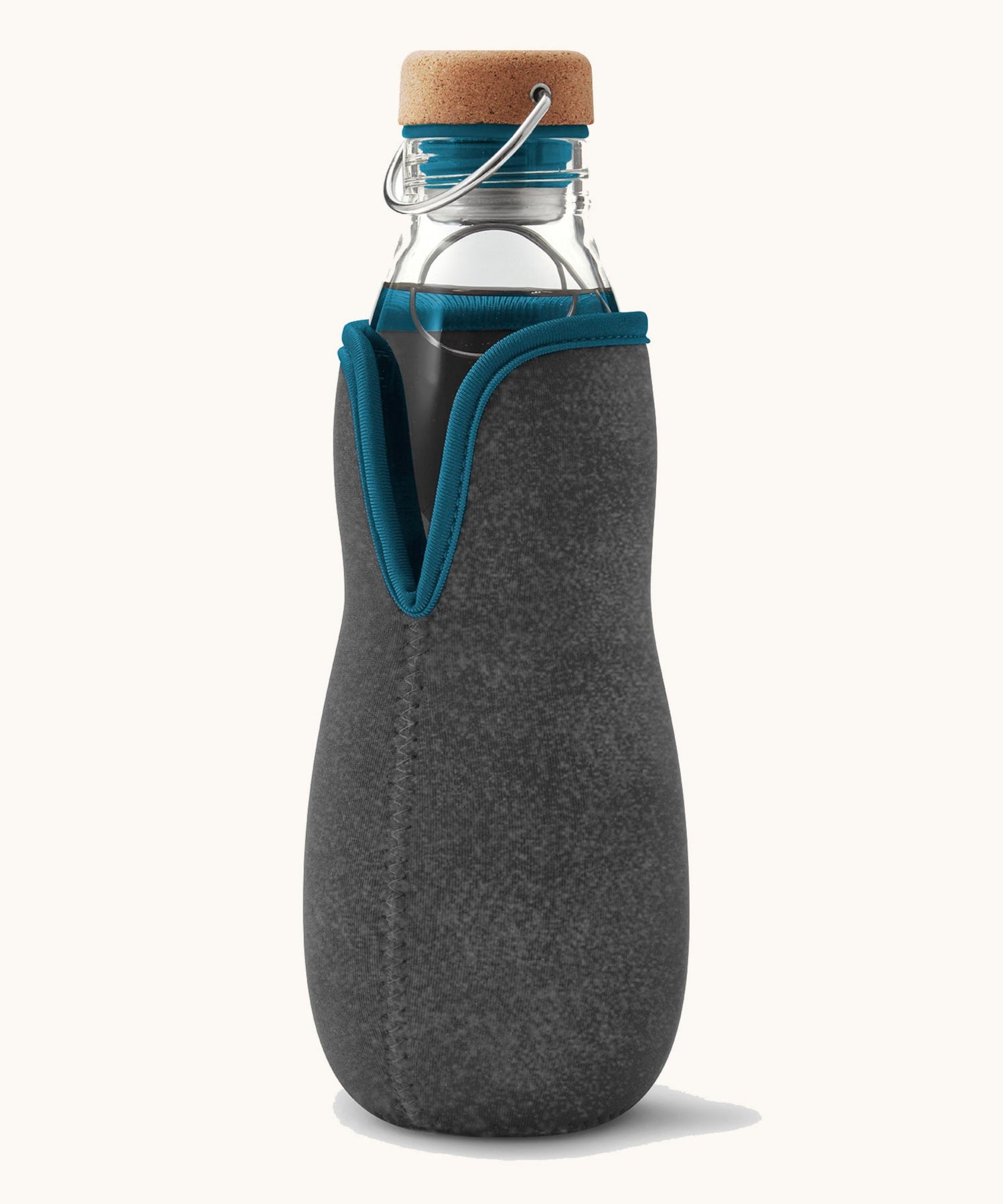 Black + Blum glass bottle with active charcoal water filter and locking coil available at Babipur. Features a felted holder with dark blue trim and a cork lid with a loop handle