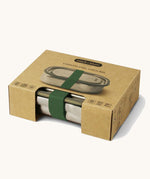 A close up of the brown cardboard packaging holding the Black + Blum leakproof stainless steel lunchbox.