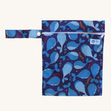 Earthwise medium wet bag in a whale design available at Babipur. A dark blue wetbag with a playful whale design. Features a white zip fastener and matching blue whale hanging loop.