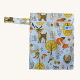 Earthwise medium wet bag in a woodland design available at Babipur. A white wetbag with a playful woodland inspired design. Features a white zip fastener and matching woodland design hanging loop.