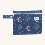 Earthwise Period Pad Purse in harvest moon design. A navy csp bag with a white zip fastener