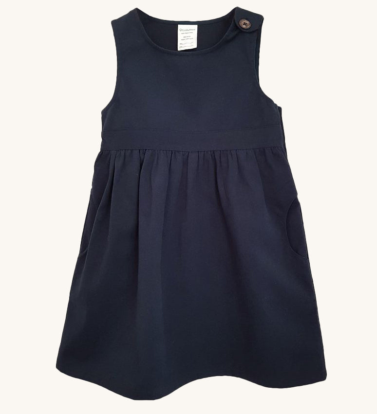 The Eco Outfitters organic and fair trade cotton school pinafore dress in navy.