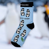 Eco kiddies light blue friendly penguins organic cotton kids socks on a blurred winter background