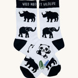 Eco kiddies wild about wildlife organic cotton kids socks. A white sock with black triml and features a cute panda, elephant and rhino design with a slogan saying 'wild about wildlife' on the cuff