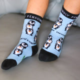 A close up of a child wearing the Eco kiddies organic cotton friendly penguins socks showing the cute playful penguin design detail