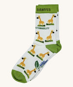 Eco kiddies organic cotton white giraffe sock with green detail and a cute giraffe design with branding on the sole
