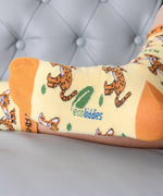 A close up of the Eco Kiddies organic cotton cheetah socks showing the cute cheetah design and the branding on the sole
