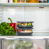 A stack of medium  Elephant box lunch bowls in a fridge and packed with different foods. This bowl is available at Babipur.
