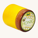 Erzi Wooden Honey Jar, on a cream background