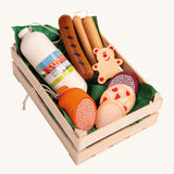 Erzi Wooden Assorted Sausages Play Food Set. A huge selection of play food sausages including different cuts of sausages, Salami, Wurst and Pepperoni together in a wooden Erzi crate lined with green paper. This would be a perfect set for playing cafes or shops!