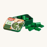 Erzi Wooden Spinach In A Tin, on a cream background. Green wooden spinach pieces with a metal tin which has a photo of real spinach on the front