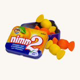 Erzi Wooden Nimm2 Bonbons In A Tin. Colourful wooden bonbon sweets which are orange and yellow, in a tin with a cream background