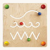 Erzi Sensory Path & Track Wall Board. A fun track game wall board, with sliding pieces which move within a cut out path. On a cream background