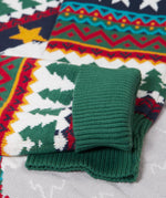 A close up of the green arm cuffs on the Frugi forest fairisle/yeti jumper available at Babipur.
