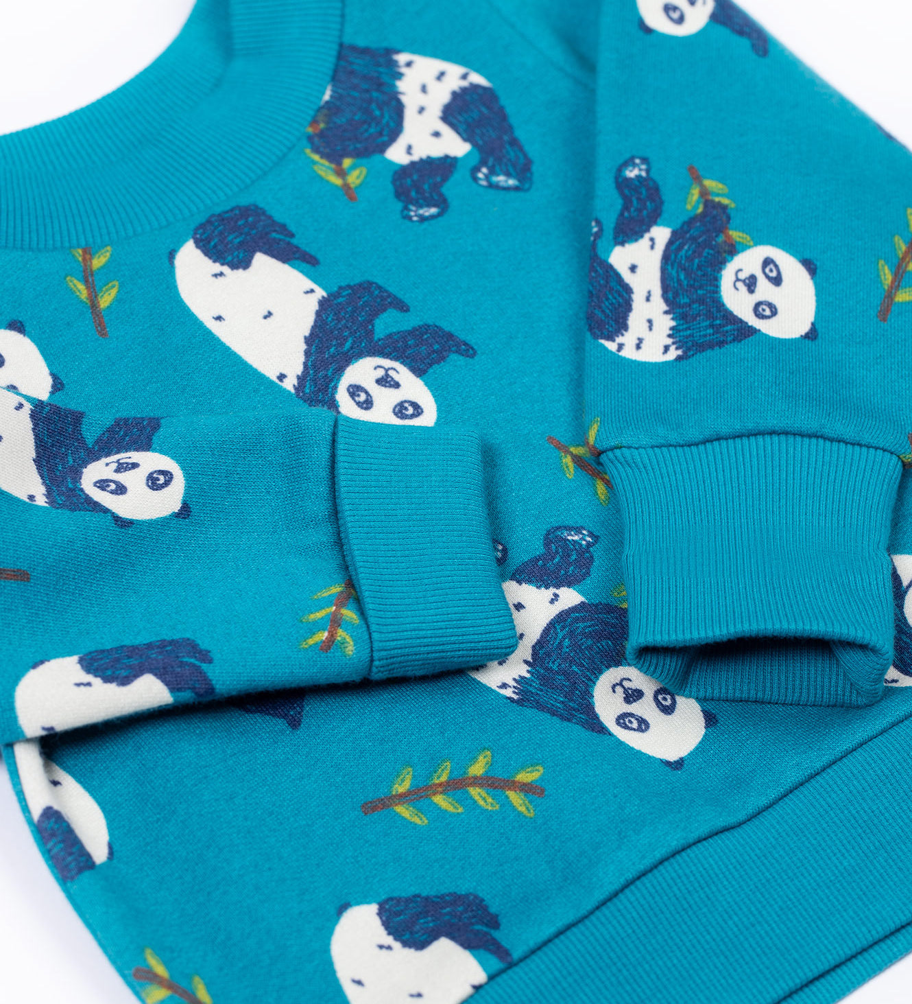 A close up of the arm cuff detail on the Frugi easy on printed jumper in panda pals available at Babipur.