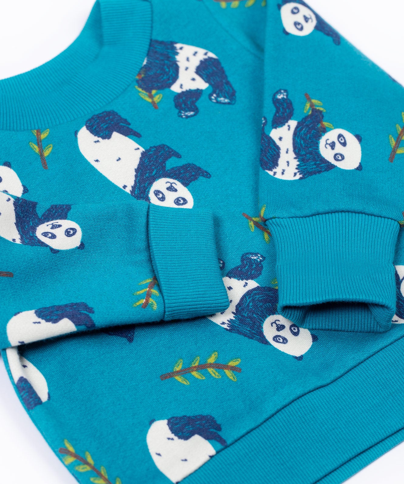 A close up of the arm cuff detail on the Frugi easy on printed jumper in panda pals available at Babipur.