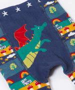 A close up of the Frugi little knitted leggings in dragon fair isle available at Babipur showing the dragon detail on the front
