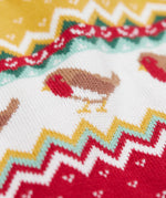 A close up of the robin on the Frugi lumi knitted festive romper fair isle available at Babipur. A GOTS organic cotton soft knitted all in one in a fairisle design with robins. Features button fasteners running down from the shoulder.