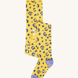 Frugi Norah tights in primrose / leopard available at Babipur. A GOTS organic cotton yellow tights with blue leopard print design and lilac contrasting heal and toe panels
