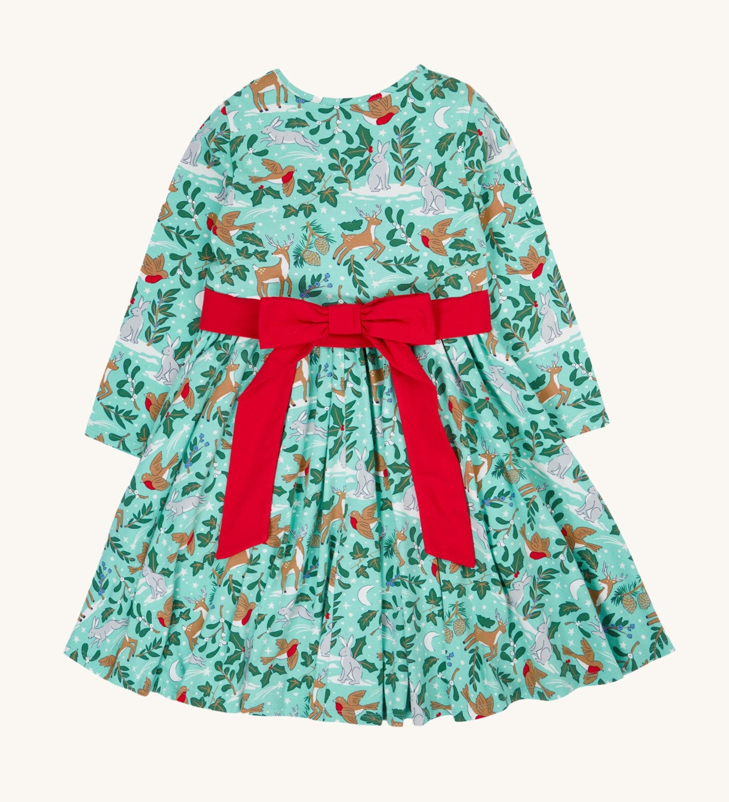 The back of the Frugi party skater dress in festive forest available at Babipur showing the red tie around the waist and tied in a festive inspired bow.