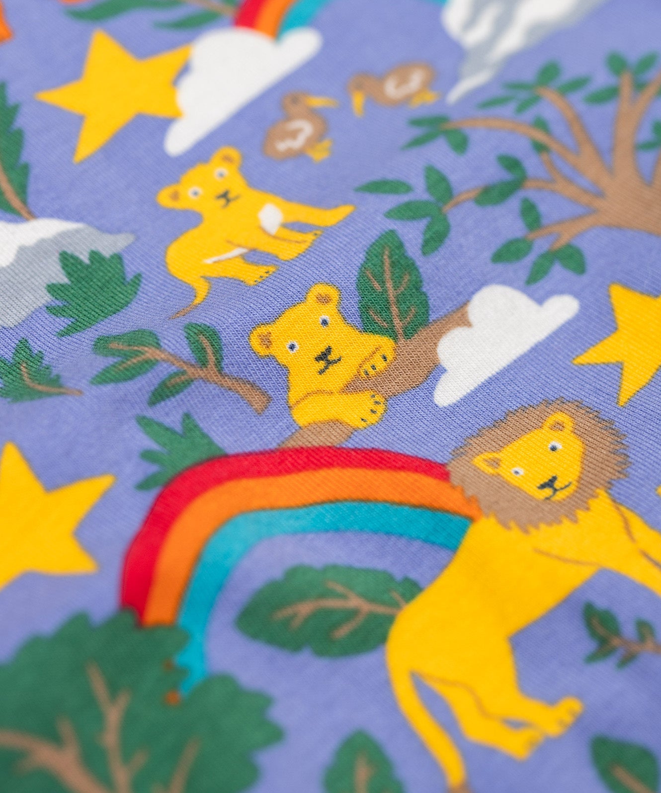 A close up of the details on the print featured on the Frugi sofia skater dress in grape / into the wild available at Babipur. A GOTS organic cotton lilac skater dress with a playful wildlife print .