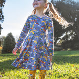 A child wearing the Frugi sofia skater dress in grape purple with a into the wild print with cheetah tights. Available at Babipur. A GOTS organic cotton lilac skater dress with a playful wildlife print.