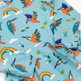 A close up of the Frugi sofia skater dress in kingfisher skies available at Babipur. A GOTS organic cotton skater dress in light blue with a lovely playful kingfisher print.