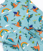 A close up of the Frugi sofia skater dress in kingfisher skies available at Babipur. A GOTS organic cotton skater dress in light blue with a lovely playful kingfisher print.