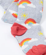 A close up of the red colour block heels on the Frugi Norah tights in grey marl / rainbow available at Babipur. A GOTS organic cotton grey tights with a playful rainbow design and red contrasting heel and toe panels