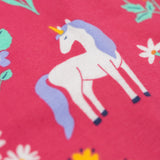A close up of a unicorn featured on the print on the Frugi sofia skater dress in rose / unicorn floral available at Babipur. A GOTS organic cotton dress in light pink with a cute unicorn and floral design.