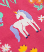 A close up of a unicorn featured on the print on the Frugi sofia skater dress in rose / unicorn floral available at Babipur. A GOTS organic cotton dress in light pink with a cute unicorn and floral design.
