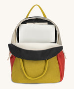 The organic cotton kids Fluf B-Pack Jr in carbon cactus, the backpack is unzipped and there's a small laptop inside.